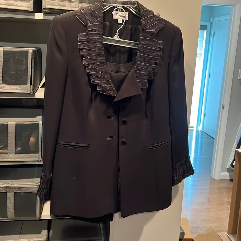 Black suit. Beautiful on!  Nice trim on collar, sleeves and shirt